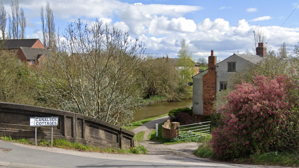 View down
	the steep ramp from the A56